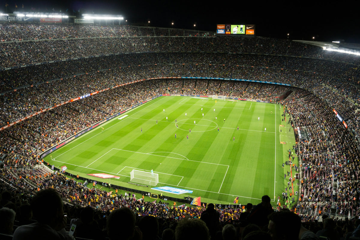 Football stadium at night full of fans